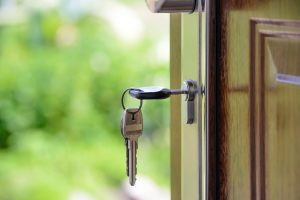 Real estate appraisal close up front door with key